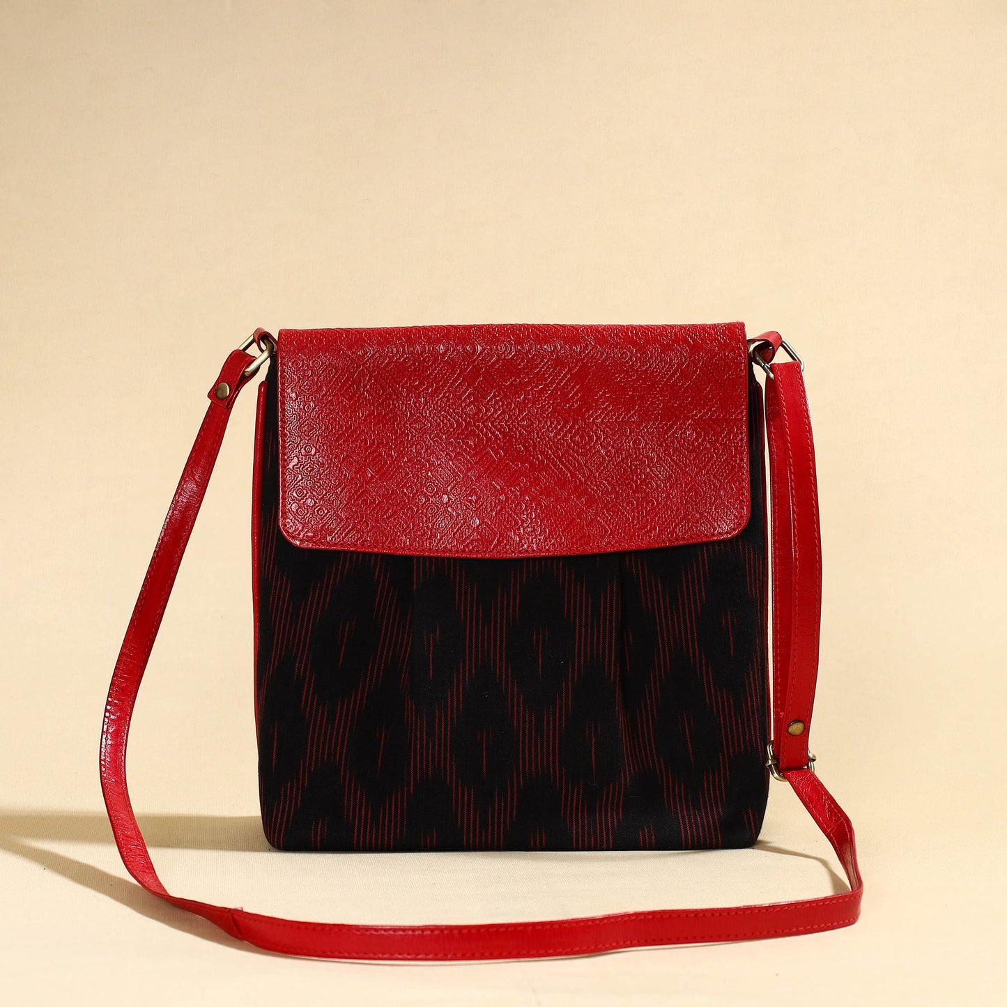 Black Handcrafted Ikat Fabric Sling Bag with Embossed Leather Flap