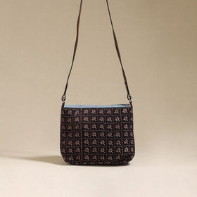 Handcrafted quilted ajrakh block printed fabric sling bag