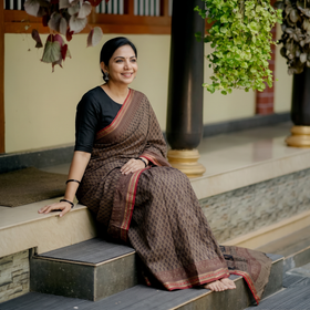Brown Block Print Natural Dyed Cotton Bagh Saree, draped and worn by a woman, AI visual of the saree, iTokri