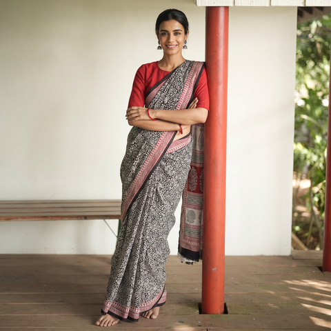 Black Block Print Natural Dyed Cotton Bagh Saree, draped and worn by a woman, AI visual of the saree, iTokri