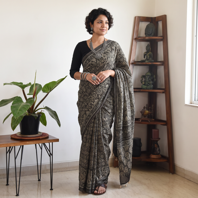 Grey Block Printed Mul Cotton Ajrakh Saree, draped and worn by a woman, AI visual of the saree, iTokri