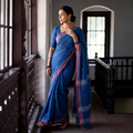 Blue Cotton Saree with Chevron Stripes on Anchal, draped and worn by a woman, AI visual of the saree, iTokri