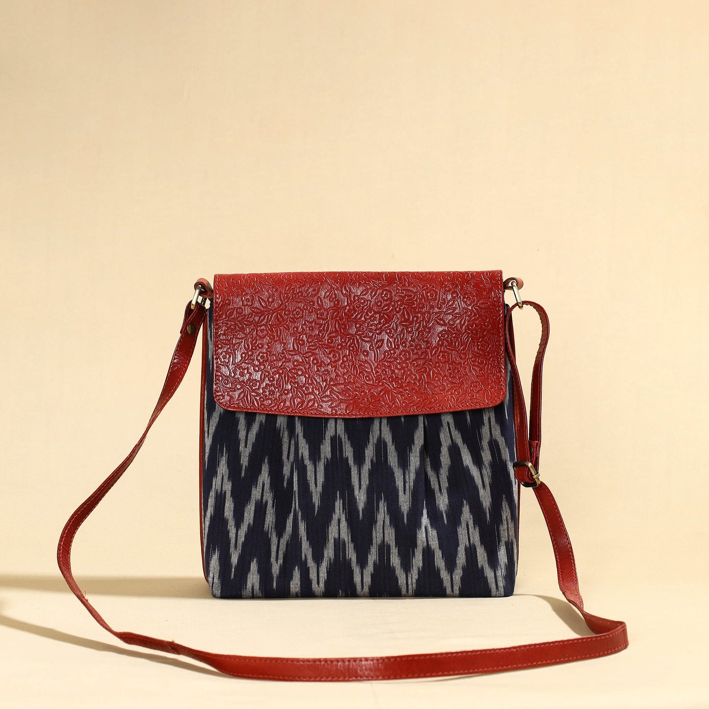 Buy Handcrafted Ikat Fabric Sling Bag with Embossed Leather Flap Online at iTokri.com