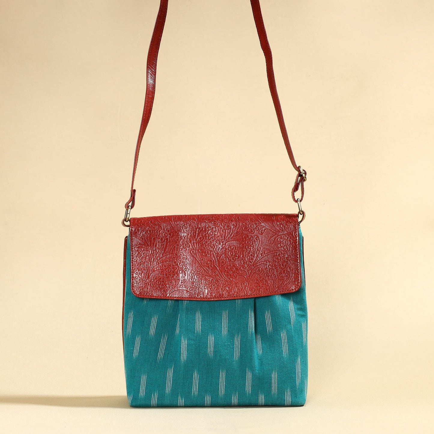 Blue Handcrafted Ikat Fabric Sling Bag with Embossed Leather Flap