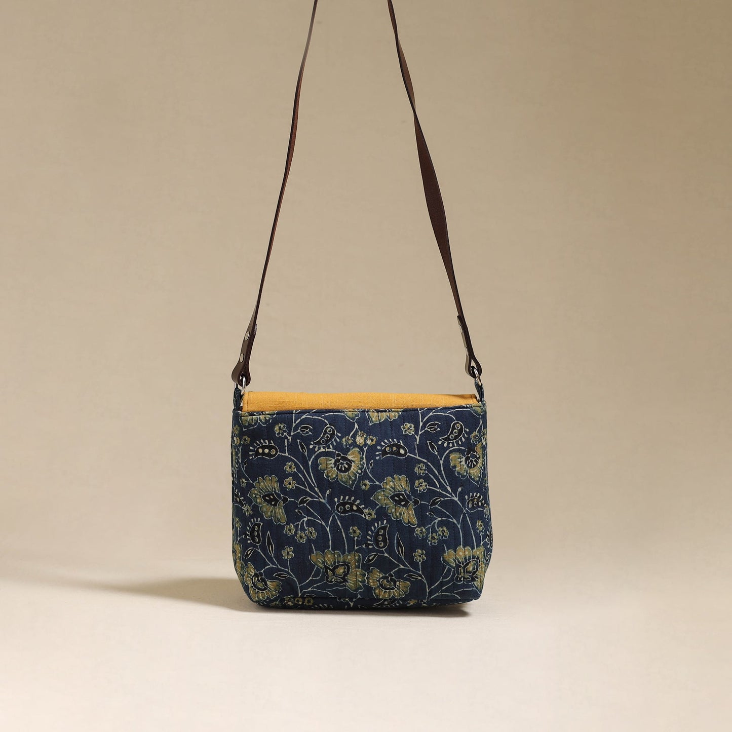 Handcrafted quilted ajrakh block printed fabric sling bag
