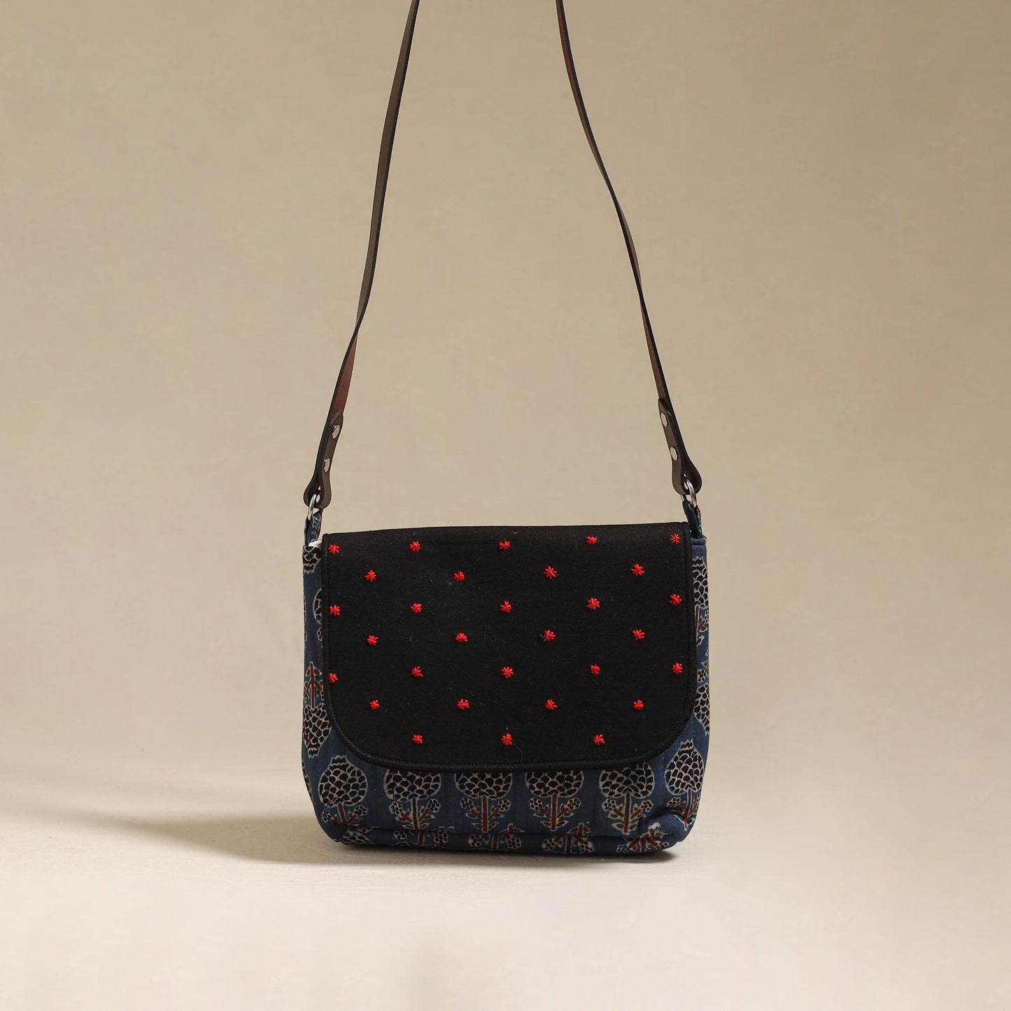 Handcrafted quilted ajrakh block printed fabric sling bag
