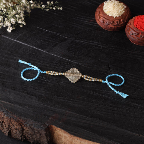 Handcrafted tribal dokra brass thread rakhi 18