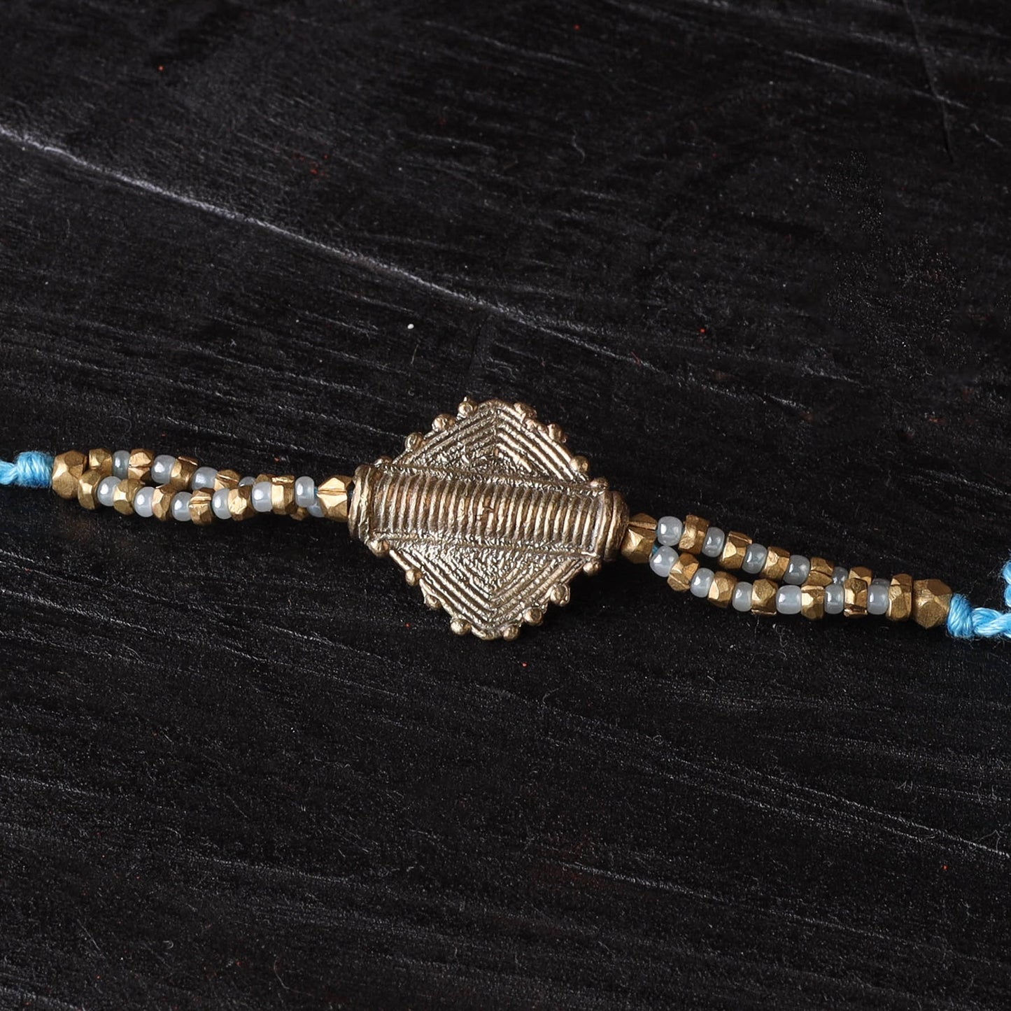 Handcrafted tribal dokra brass thread rakhi 18