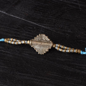 Handcrafted tribal dokra brass thread rakhi 18