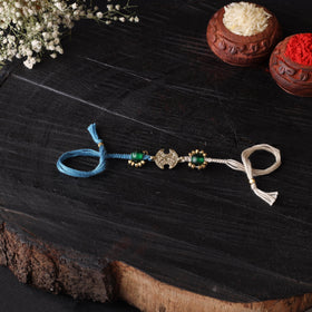 Handcrafted tribal dokra brass thread rakhi 28