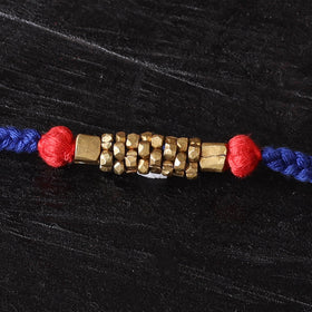 Handcrafted tribal dokra brass thread rakhi 41