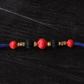 Handcrafted tribal dokra brass thread rakhi 48
