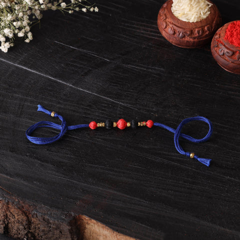 Handcrafted tribal dokra brass thread rakhi 48