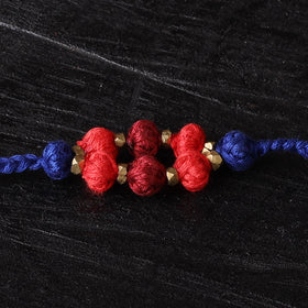 Handcrafted tribal dokra brass thread rakhi 50