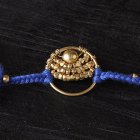 Handcrafted tribal dokra brass thread rakhi 56