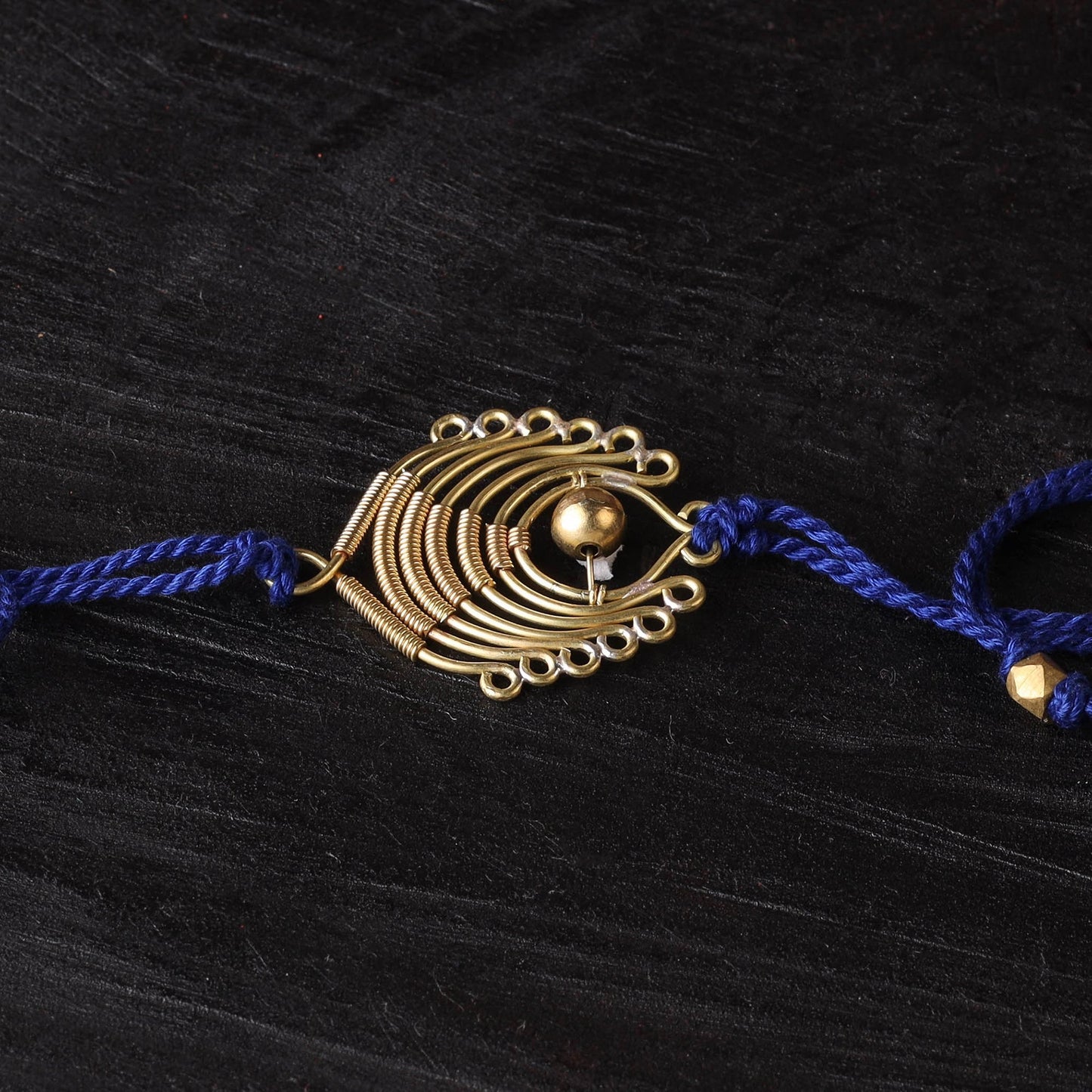 Handcrafted tribal dokra brass thread rakhi 60