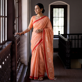 Brick Peach Cotton Saree with White Jaal Pattern on Pallu, draped and worn by a woman, AI visual of the saree, iTokri