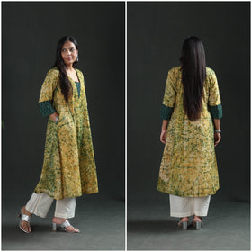 Two frames of the yellow kurta: side with a hand in the seam pocket, and the plain back