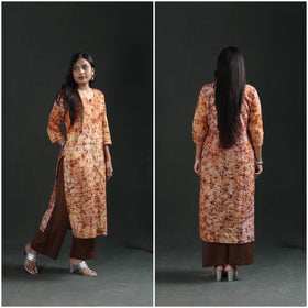 Side and back frames of the peach cream kurta showing the side slit and plain back