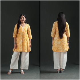 Front and back of the mustard yellow short kurta, full length, in two frames