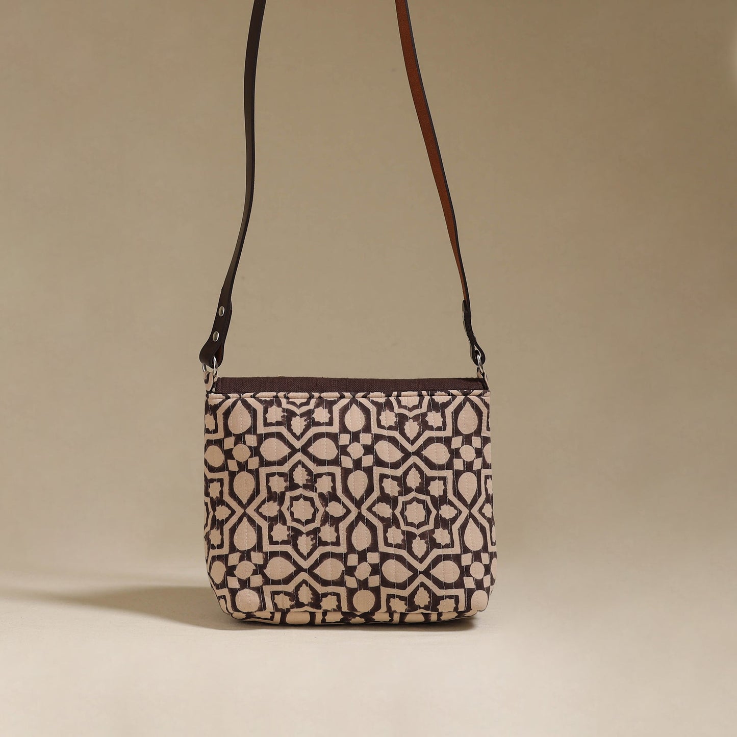 Handcrafted quilted ajrakh block printed fabric sling bag