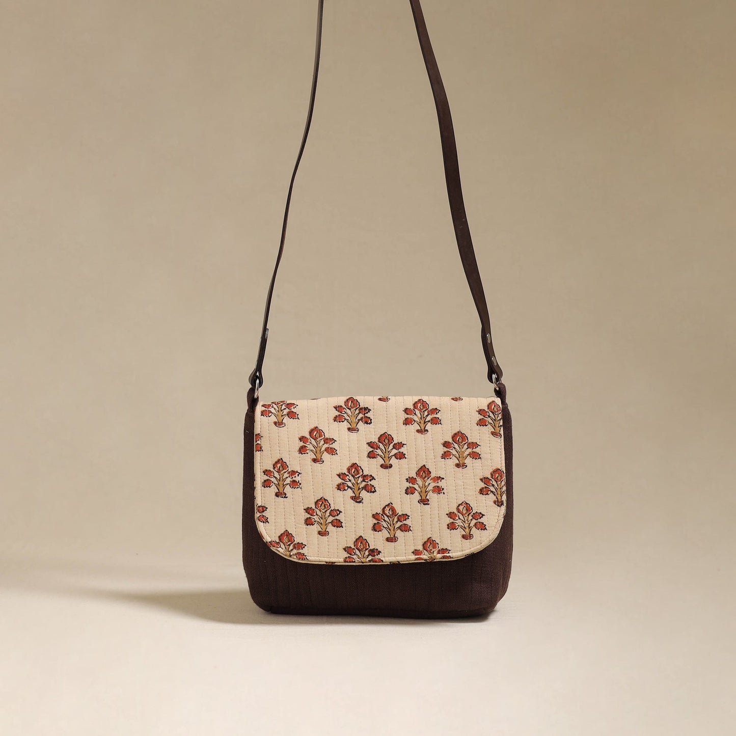 Handcrafted quilted ajrakh block printed fabric sling bag