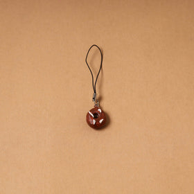 Brown - quirklets handpainted clay bag doughnut charm