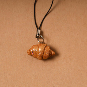 Brown - quirklets handpainted clay croissant bag charm