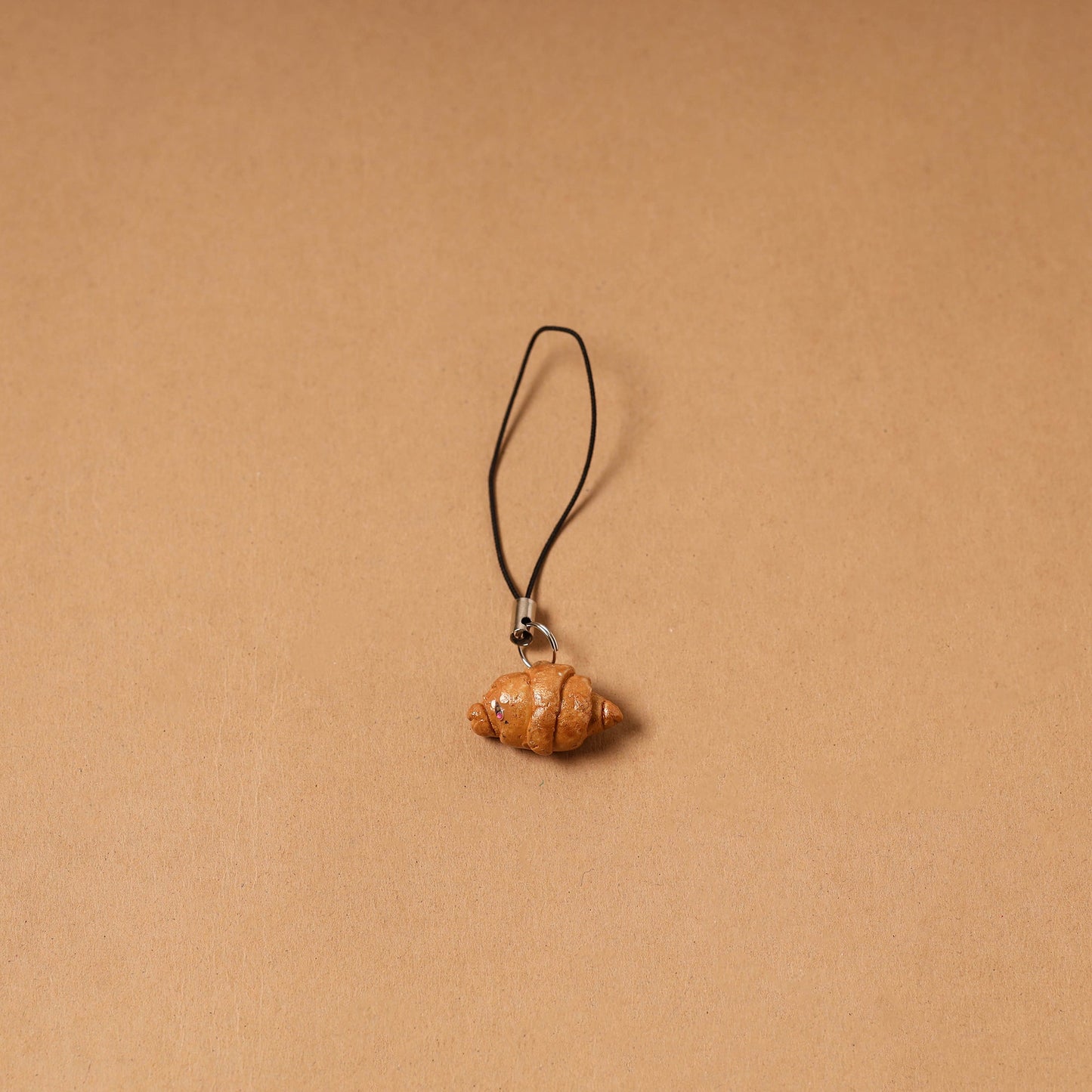 Brown - quirklets handpainted clay croissant bag charm