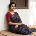 Black Chanderi Silk Hand Block Print Bagru Saree with Zari Border, draped and worn by a woman, AI visual of the saree, iTokri