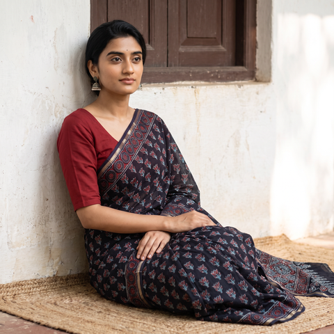 Black Chanderi Silk Hand Block Print Bagru Saree with Zari Border, draped and worn by a woman, AI visual of the saree, iTokri
