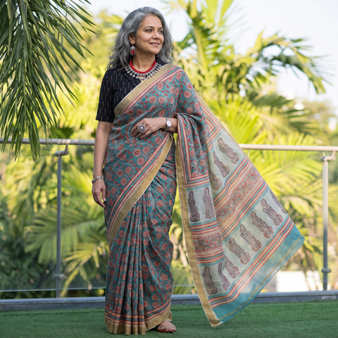 Blue Chanderi silk hand block print Sanganeri saree with ghicha border, draped and worn by a woman, AI visual of the saree, iTokri
