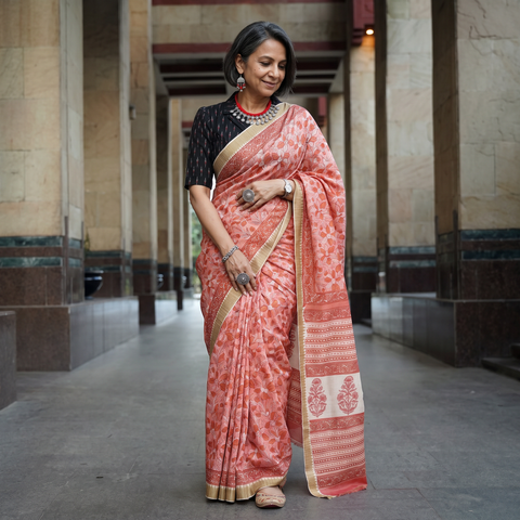 Pink Chanderi silk hand block print Sanganeri saree with ghicha border, draped and worn by a woman, AI visual of the saree, iTokri
