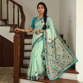 Green Chanderi Silk Hand Embroidery Phulkari Saree, draped and worn by a woman, AI visual of the saree, iTokri