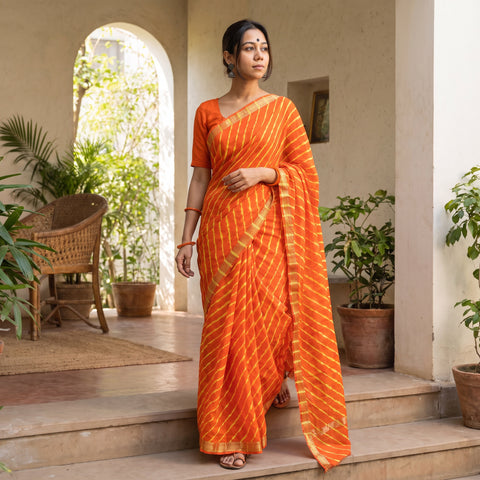 Orange Chanderi Silk Leheriya Tie-Dye Saree with Zari Border, draped and worn by a woman, AI visual of the saree, iTokri