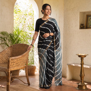 Grey Chanderi Silk Leheriya Tie-Dye Saree with Zari Border, draped and worn by a woman, AI visual of the saree, iTokri