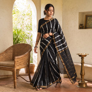 Black Chanderi Silk Leheriya Tie-Dye Saree with Zari Border, draped and worn by a woman, AI visual of the saree, iTokri