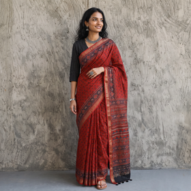 Red Chanderi Silk Natural Dyed Zari Border Ajrakh Print Saree, draped and worn by a woman, AI visual of the saree, iTokri