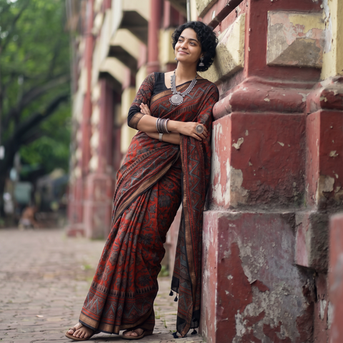 Red Chanderi Silk Natural Dyed Zari Border Ajrakh Print Saree, draped and worn by a woman, AI visual of the saree, iTokri