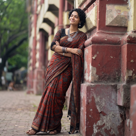 Red Chanderi Silk Natural Dyed Zari Border Ajrakh Print Saree, draped and worn by a woman, AI visual of the saree, iTokri