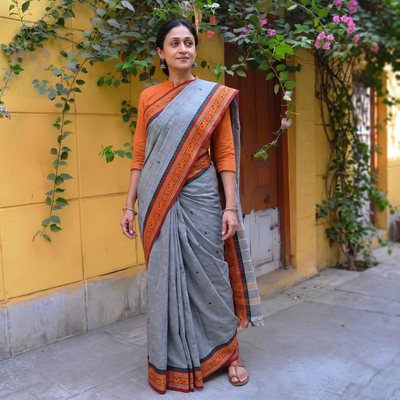 Grey Chettinad Cotton Saree with Border, draped and worn by a woman, AI visual of the saree, iTokri