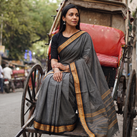 Grey Chettinad Cotton Saree with Border, draped and worn by a woman, AI visual of the saree, iTokri