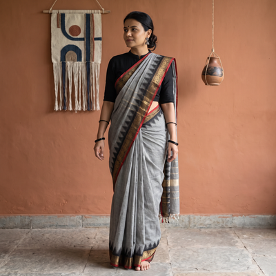 Grey Chettinad Cotton Saree with Border, draped and worn by a woman, AI visual of the saree, iTokri