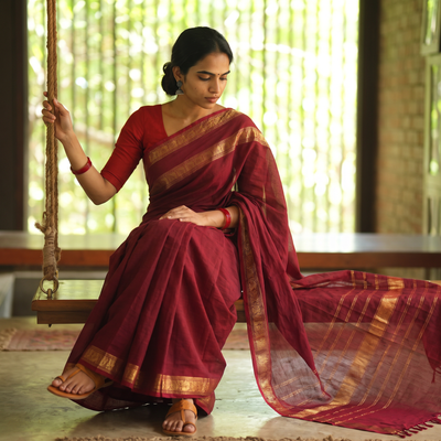 Maroon Chettinad Woven Cotton Saree with Border, draped and worn by a woman, AI visual of the saree, iTokri