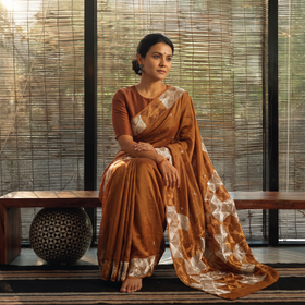 Brown Chinon Silk Hand Embroidery Phulkari Saree, draped and worn by a woman, AI visual of the saree, iTokri