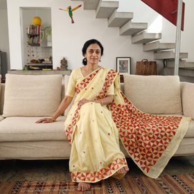 Yellow Chinon Silk Hand Embroidery Phulkari Saree, draped and worn by a woman, AI visual of the saree, iTokri