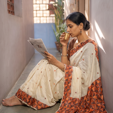 Beige Chinon Silk Hand Embroidery Phulkari Saree, draped and worn by a woman, AI visual of the saree, iTokri