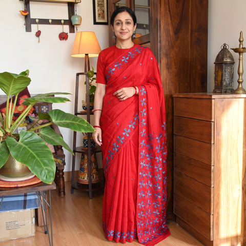 Red Chinon Silk Hand Embroidery Phulkari Saree, draped and worn by a woman, AI visual of the saree, iTokri