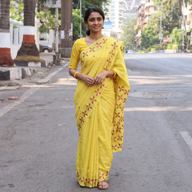 Yellow Chinon Silk Hand Embroidery Phulkari Saree, draped and worn by a woman, AI visual of the saree, iTokri