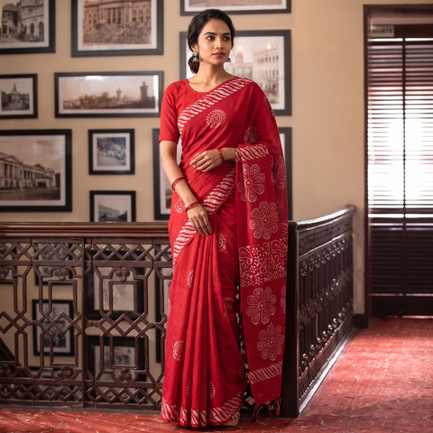 Red Cotton Hand Batik Print Saree, draped and worn by a woman, AI visual of the saree, iTokri